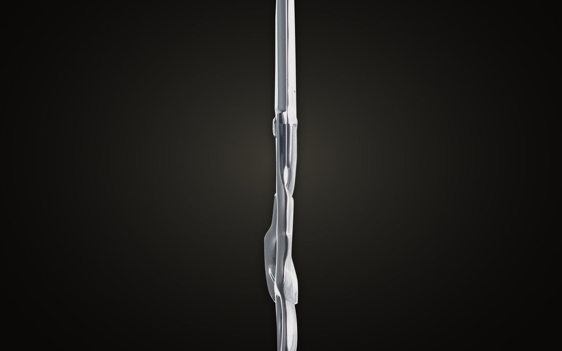 Chromium cutting shear, edge-on profile view showing blade thickness, on onyx